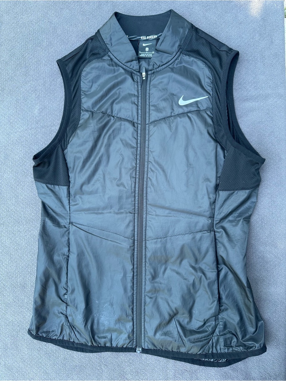 Nike Women's Black Sleeveless Puffer Vest with Reflective Swoosh